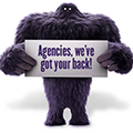 Monster holding a card that says Agencies we've got your back.